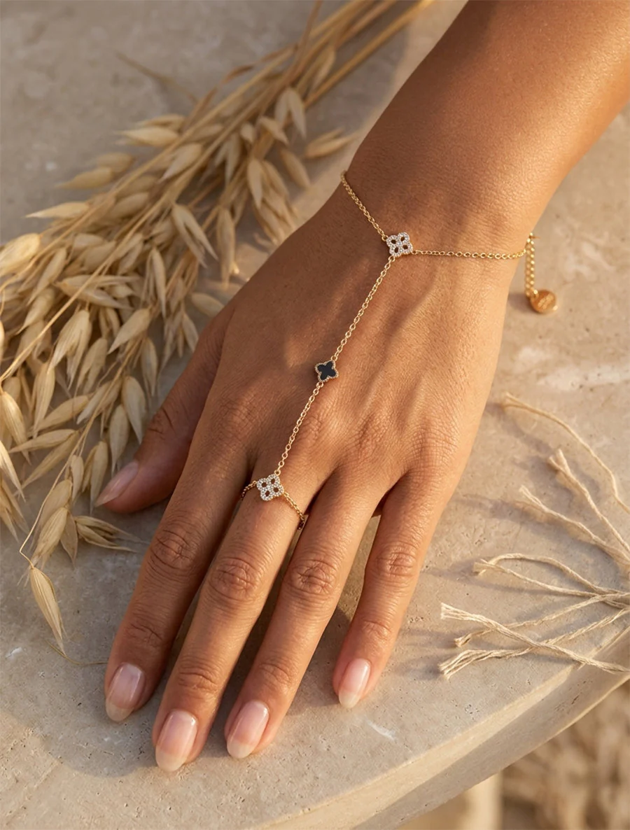 Armband met klavers versierd met witte zirkonia's - Goud