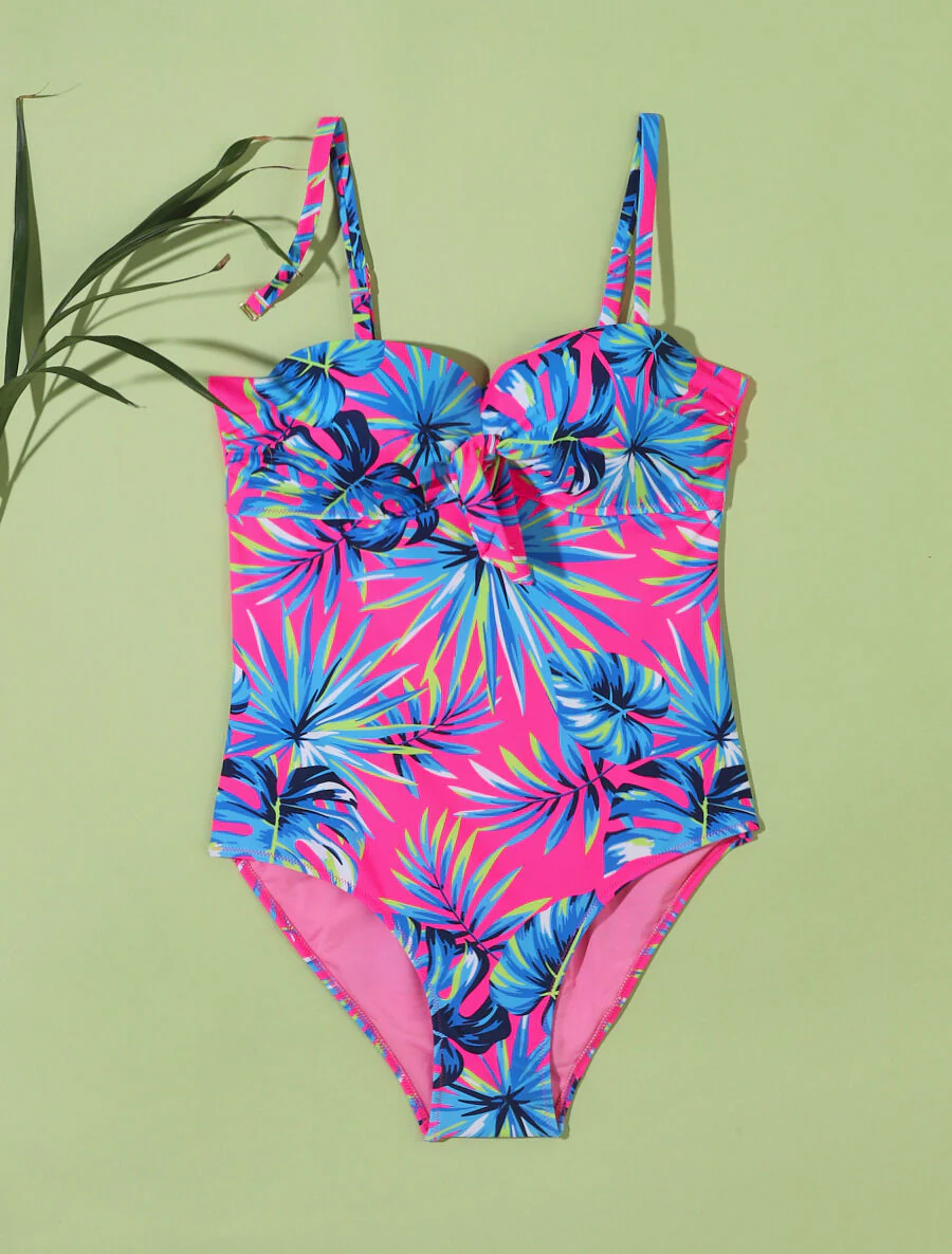 Eendelig badpak met tropisch bladprint - Fluor roze
