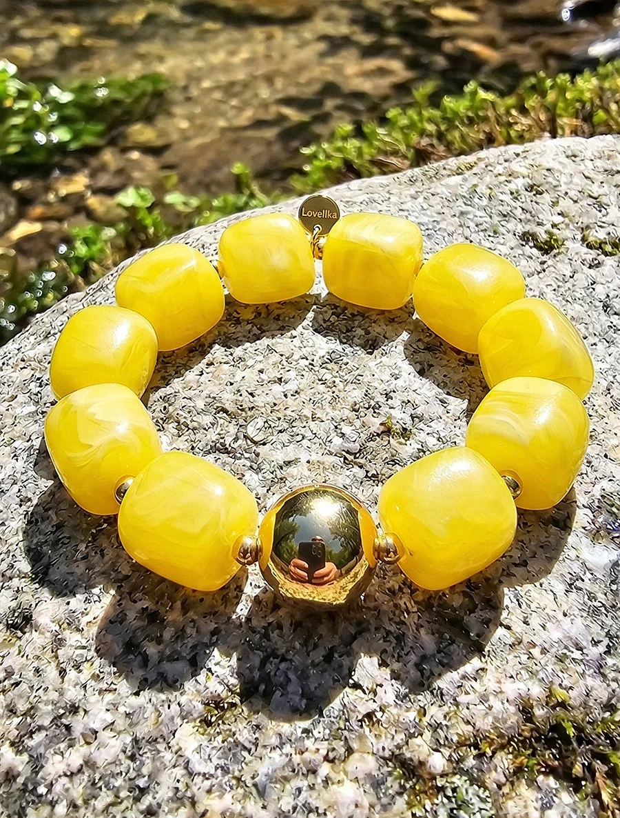 Kralenarmband van hars en metaal - Geel