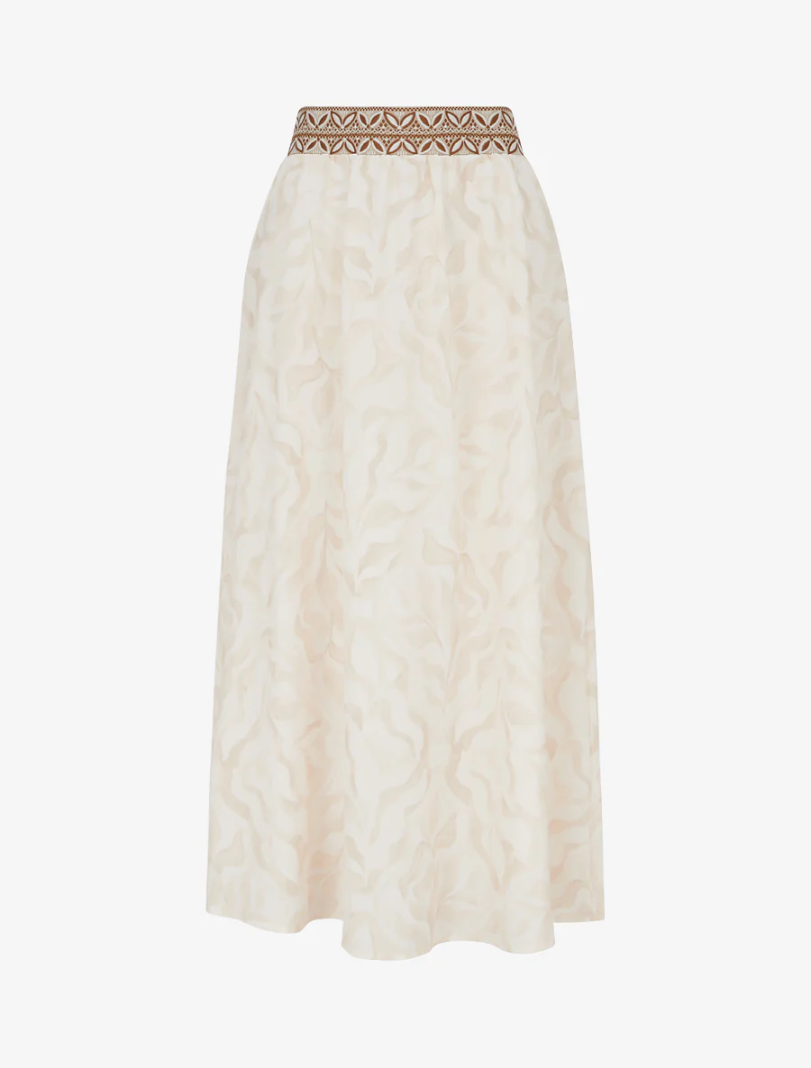Lange vloeiende rok met gestileerde bladdessin. - Beige