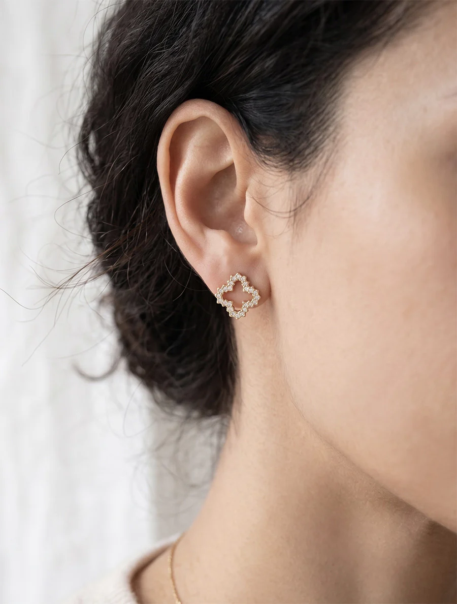 Oorbellen met klavermotief en strass-steentjes - Goud
