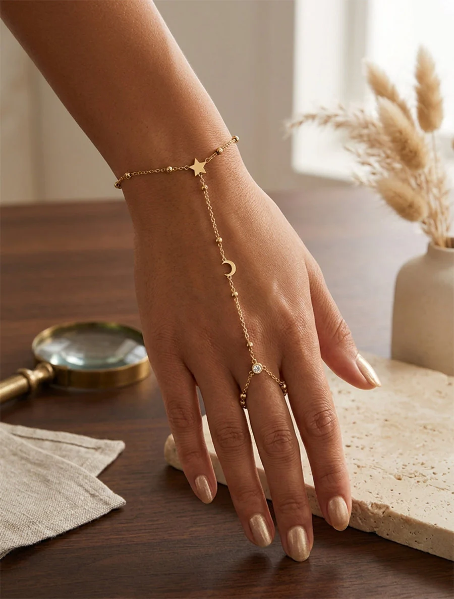 Sterren- en halve maanhandketting met een witte zirkonia - Goud