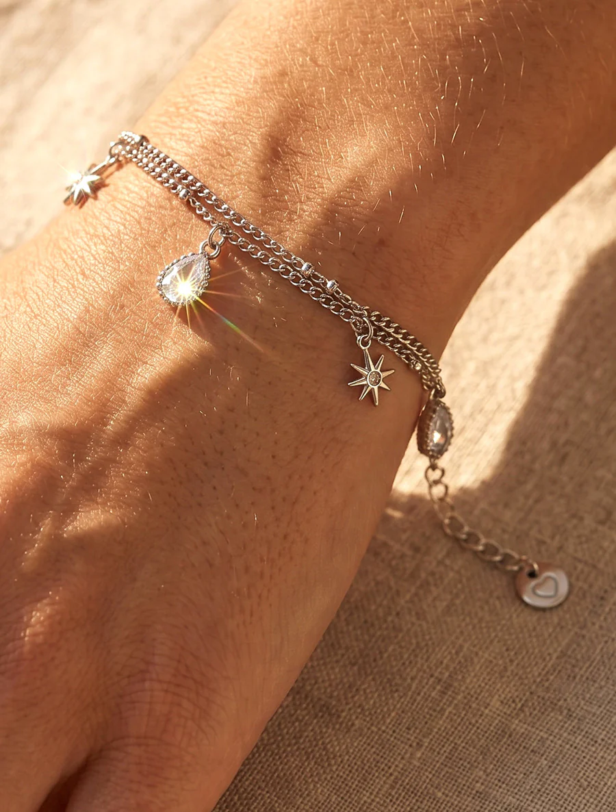 Sterrenarmband en druppels versierd met witte zirkoonstenen - Geld