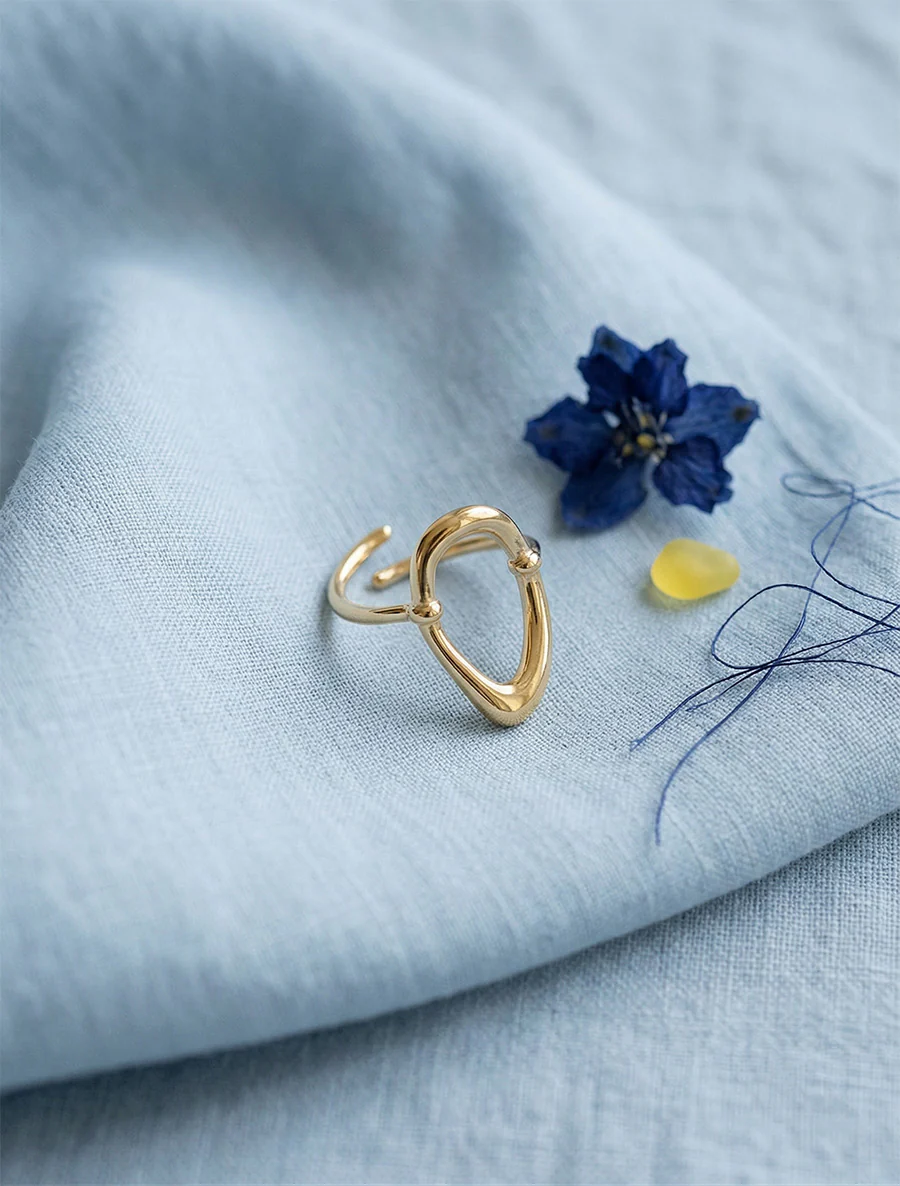 Verstelbare ring met opengewerkt ovaal motief - Goud